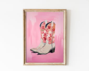 May include: A framed painting of a pair of white cowboy boots with pink floral embroidery on a pink background.