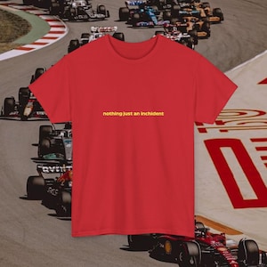 May include: Red t-shirt with the text "nothing just an incident" in yellow.
