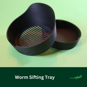May include: A black plastic worm sifting tray with a grid pattern on the bottom. The tray is designed to separate worms from castings.