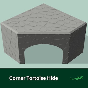 May include: A grey corner tortoise hide with a textured surface. The hide has a rounded archway opening.