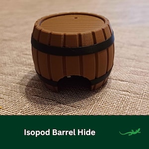 May include: A brown wooden barrel hide for isopods, with a black band around the middle. The barrel has a small opening on the bottom for the isopods to enter.