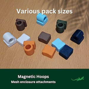 May include: Various sizes of magnetic hoops in different colours, including white, brown, orange, blue, and green. The text "Various pack sizes" and "Magnetic Hoops Mesh enclosure attachments" is visible in the image.