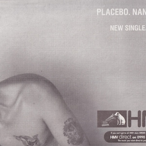 May include: A black and white photo of a person's torso with a tattoo on their arm. The text "PLACEBO. NANCY BOY" and "NEW SINGLE. 2xCD. 7" is at the top of the image. The text "HMV" is at the bottom of the image with the text "If you can't get to an HMV store ORDER BY PHONE from HMV direct on 0990 33 45 78. The music you want direct to your door." below it.