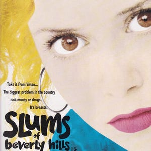 May include: Movie poster for "Slums of Beverly Hills" featuring Alan Arkin, Marisa Tomei, and Natasha Lyonne. The poster has a close-up of a woman's face with text: "Take it from Vivian... The biggest problem in the country isn't money or drugs. It's breasts."