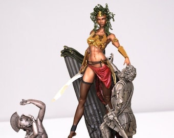May include: A detailed figurine of a woman with green snakes for hair, wearing a gold and red costume, holding a sword and standing on a stone base. Two other figures are at her feet.