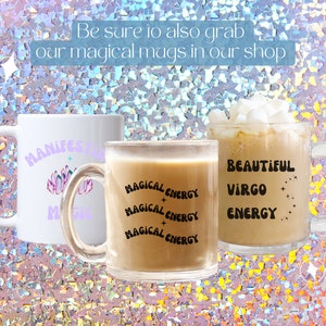 May include: Three mugs with text and designs. One white mug has "MANIFEST" and "MAGIC" in purple, with a crystal design. A clear mug has "MAGICAL ENERGY" repeated. A clear mug has "BEAUTIFUL VIRGO ENERGY".