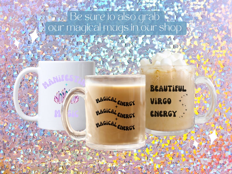 May include: Three mugs with text and designs. One white mug has "MANIFEST" and "MAGIC" in purple, with a crystal design. A clear mug has "MAGICAL ENERGY" repeated. A clear mug has "BEAUTIFUL VIRGO ENERGY".