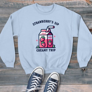 Strawberry Milk Creamy Trip Cartoon-stijl unisex sweater, retro grafische trui, trendy en leuke stijl