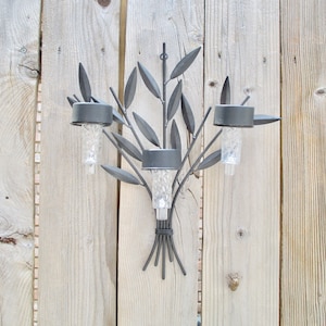 Unique decorative solar light with metal holder for fence, deck, garden or balcony.