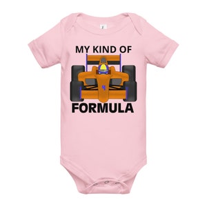 May include: Pink baby onesie with a black graphic of a cartoon orange race car and the text "My Kind of Formula".