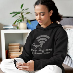 May include: Black hoodie with a white rhinestone design of a wifi symbol and the text "Prayer: The world's greatest wireless connection."