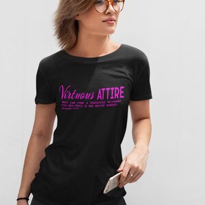 May include: Black t-shirt with a pink graphic that reads "Virtuous Attire" and a quote from Proverbs 31:10.