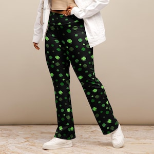 May include: Black flared pants with a green shamrock print.