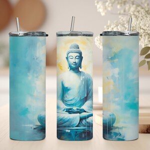 May include: Three stainless steel tumblers with a blue and yellow watercolor design featuring a meditating Buddha. The tumblers have lids and straws.