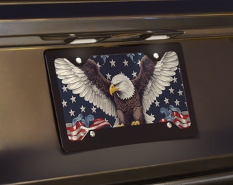 May include: A black license plate frame with a bald eagle with outstretched wings against a blue and white American flag background.