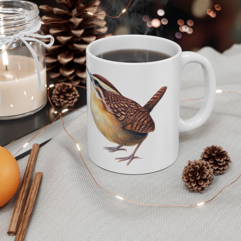 11 oz Ceramic Coffee Mug with "Bird Nerd" text on one side, and a Carolina wren illustration on the other.