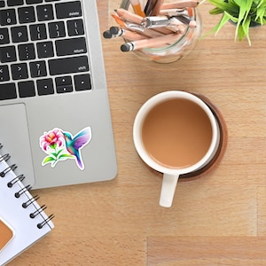 Colorful Hummingbird with Flower Sticker: Charming Colored Pencil Artwork