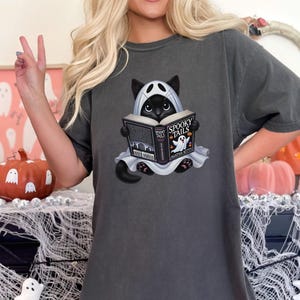Retro Halloween T-shirt: Librarian Cat Ghost Reading Books Pepper