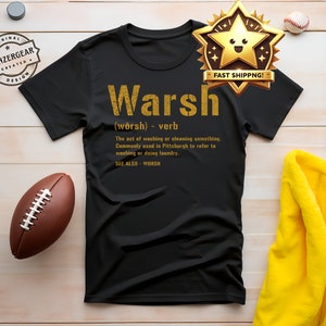 May include: Black t-shirt with gold text that reads "Warsh (worsh) verb The act of washing or cleaning something. Commonly used in Pittsburgh to refer to washing or doing laundry. SEE ALSO - WORSH"
