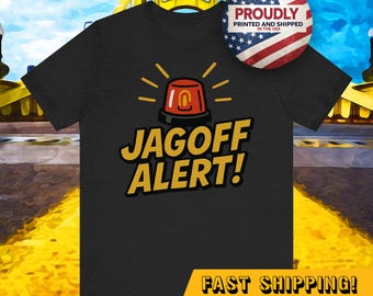 May include: Black t-shirt with a yellow and red cartoon siren and the text "Jagoff Alert!" in yellow. The text "Fast Shipping!" is in yellow at the bottom of the shirt.