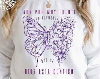 May include: White sweatshirt with a purple butterfly and floral design. The text "Aun por muy fuerte la tormenta que se Dios esta contigo" is printed on the front.