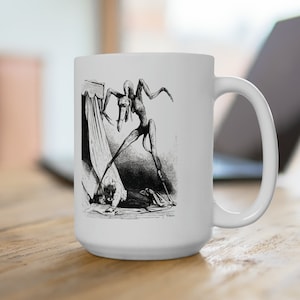 May include: White ceramic mug with a black and white illustration of a creature with long limbs and a beak reaching towards a person lying on the floor. The creature appears to be emerging from a curtain.