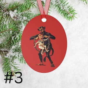 May include: Red round Christmas ornament featuring a vintage illustration of a devil holding a child in chains. The devil is wearing a red suit and has horns and a tail. The child is wearing a white shirt and blue pants.