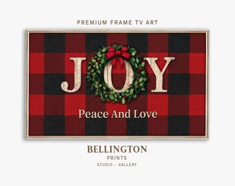 May include: A framed digital art print with a red and black buffalo plaid pattern. The word "JOY" is displayed with a wreath and red bow. The text "Peace And Love" is below the word "JOY". The text "PREMIUM FRAME TV ART" is at the top.