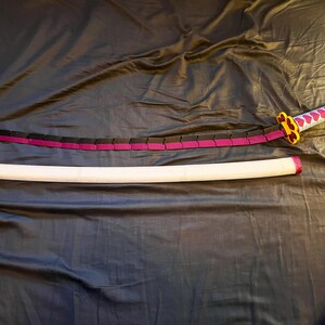 Blade straight next to scabbard