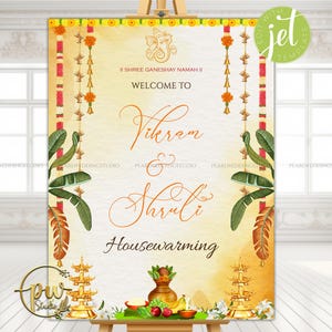 May include: A welcome sign for a housewarming event. The sign features the names "Vikram & Shruti" in elegant script. The design includes traditional Indian motifs, floral garlands, and a golden color scheme. The text "Housewarming" is also displayed.