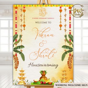 May include: A wedding welcome sign with the names Vikram & Shruti, and the word "Housewarming". The sign has a yellow and orange background with floral and leaf decorations. The text "II SHREE GANESHAY NAMAH II" is at the top.