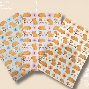 May include: Three patterned fabric sheets with a repeating design of capybaras and flowers. The sheets feature different background colors: light blue, pink, and off-white. The text "Colors will vary from images due to differences in device screens" is visible.