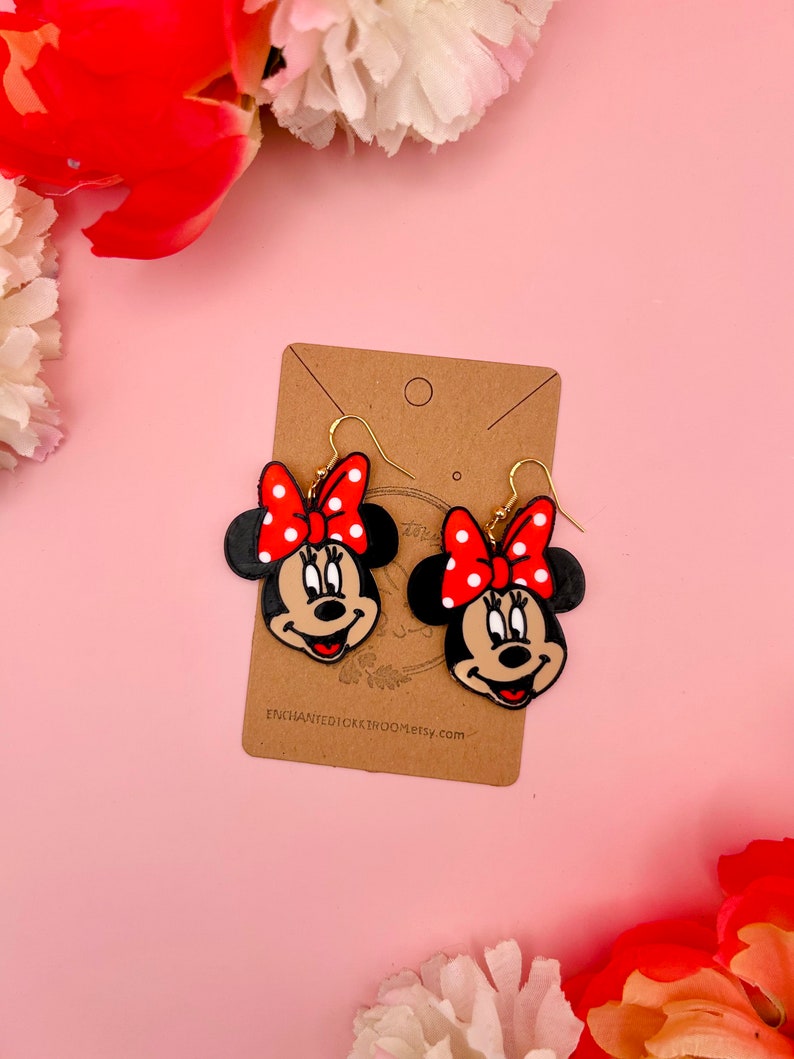 Minnie:
--- Width 1.4 inches
--- Length 1.7 inches
--- Drop length 2.2 inches