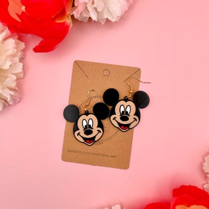 Mickey:
--- Width 1.6 inches
--- Length 1.4 inches
--- Drop length 2.0 inches