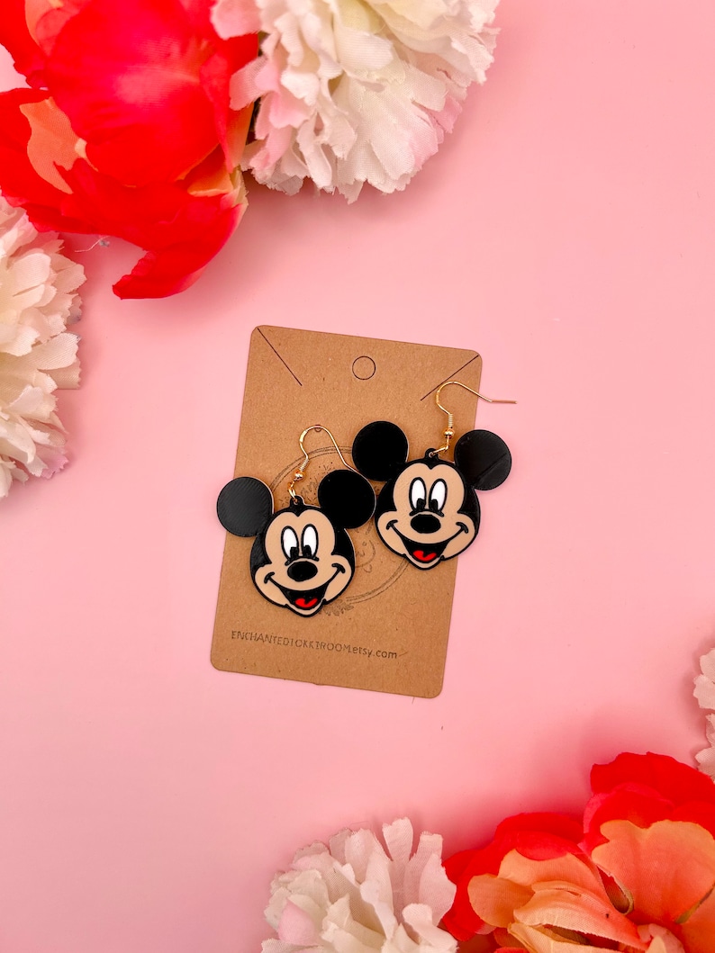 Mickey:
--- Width 1.6 inches
--- Length 1.4 inches
--- Drop length 2.0 inches