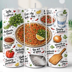 May include: A white cylindrical tumbler featuring a colorful food-themed print. Illustrations include a lahmacun, a bowl of salad, a glass of ayran, an onion, a wooden paddle, and a baking tray. Text includes "Taste of tradition," "Freshly baked love," and "Culinary joy."