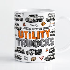 May include: A white ceramic mug featuring a graphic print of various utility trucks, construction cones, tools, and road signs. The text "LIFE IS BETTER WITH UTILITY TRUCKS" is printed in the center with orange and grey lettering on a white background.