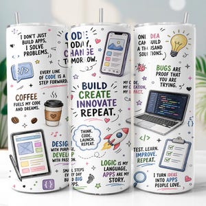 May include: A white cylindrical tumbler with a metal straw featuring colorful illustrations of a laptop, smartphone, tablet, rocket, and lightbulb. Text includes "Build Create Innovate Repeat," "Coffee fuels my code," and "I don't just build apps."