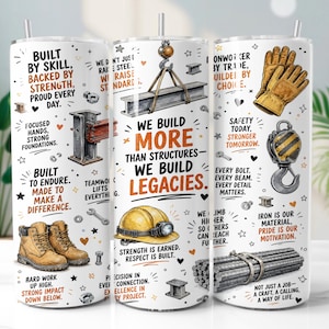 May include: A cylindrical metal tumbler featuring a white background with illustrations of construction gear including a yellow hard hat, tan work boots, leather gloves, steel beams, and a crane hook, accompanied by motivational text about ironwork.