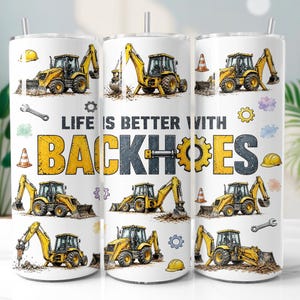 May include: A white cylindrical tumbler with a straw featuring a repeating pattern of yellow backhoe construction vehicles, orange traffic cones, wrenches, and gears. The text reads LIFE IS BETTER WITH BACKHOES in bold yellow and black letters.