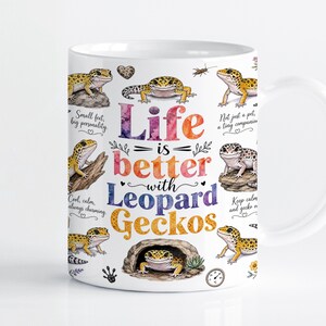 May include: A white ceramic mug featuring colorful illustrations of leopard geckos in various poses. The text reads Life is better with Leopard Geckos, accompanied by phrases like Small feet, big personality and Not just a pet, a tiny companion.