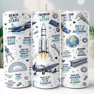 May include: A white cylindrical tumbler featuring blue and black illustrations of rockets, aeroplanes, satellites, and engineering tools. Text includes 'Reach for the stars', 'Engineer the future', 'Precision in every detail', and 'Sky is just the playground'.