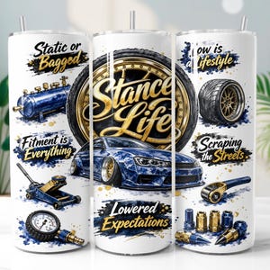 May include: A white cylindrical tumbler featuring automotive graphics including a blue car, a tyre, a jack, a pressure gauge, and lug nuts. Text includes "Static or Bagged," "Stance Life," "Fitment is Everything," "Scraping the Streets," and "Lowered Expectations."