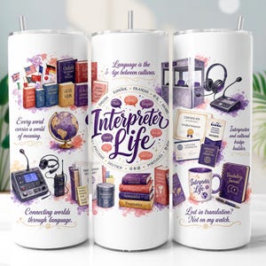 May include: A white cylindrical tumbler featuring colourful illustrations of books, a globe, interpretation equipment, and text including "Interpreter Life," "Language is the bridge between cultures," "Every word carries a world of meaning."