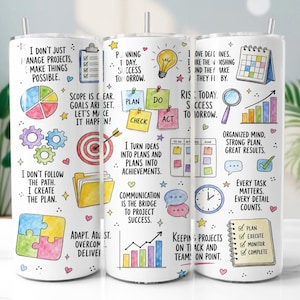 May include: A white cylindrical tumbler with a straw featuring colorful illustrations of project management icons, including a pie chart, target, gears, calendar, and checklist, alongside motivational text such as I don't just manage projects, make things possible.