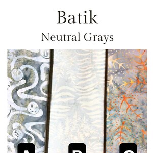 May include: Three fabric swatches of batik fabric in neutral grey colours. The fabric on the left has a swirling pattern, the middle fabric has a striped pattern, and the fabric on the right has a floral pattern. The swatches are labelled A, B, and C.