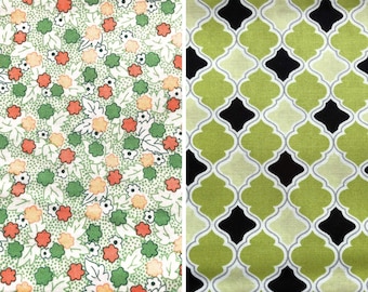 May include: Two fabric swatches with different patterns. The first swatch has a white background with a green, orange, and yellow floral pattern. The second swatch has a green background with a black and white geometric pattern.