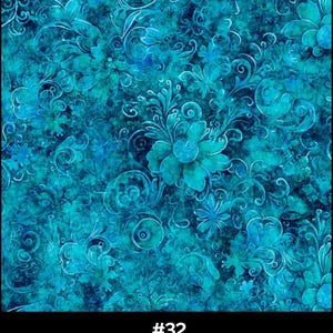 May include: A fabric with an all-over floral design in shades of aquamarine and teal. The pattern features stylized flowers, leaves, and swirling vines. The text at the bottom reads "#32 Aquamarine Blue".