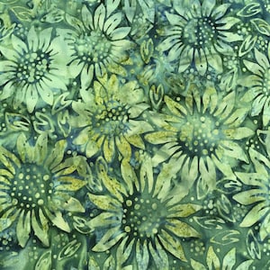 May include: A fabric with a repeating pattern of stylized sunflowers in shades of green and yellow. The design features detailed petals and centers, with a mottled, batik-like effect. The background is a deep teal color, creating a contrast with the lighter floral elements.