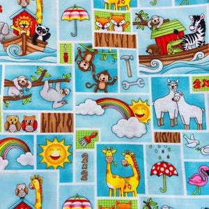 May include: A whimsical fabric pattern featuring a light blue background with various cartoon animals and objects. Giraffes, monkeys, sloths, and zebras are depicted, along with rainbows, umbrellas, and tools. The design includes the number "2x2" in several squares.